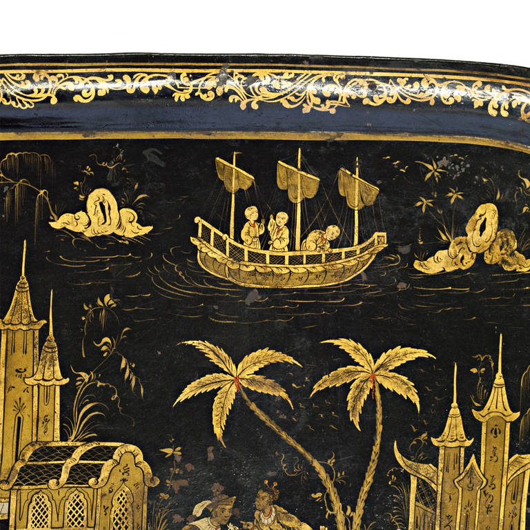 A large 1860s French Napoleon III black and gilt japanned tole tray with chinoiserie imagery.