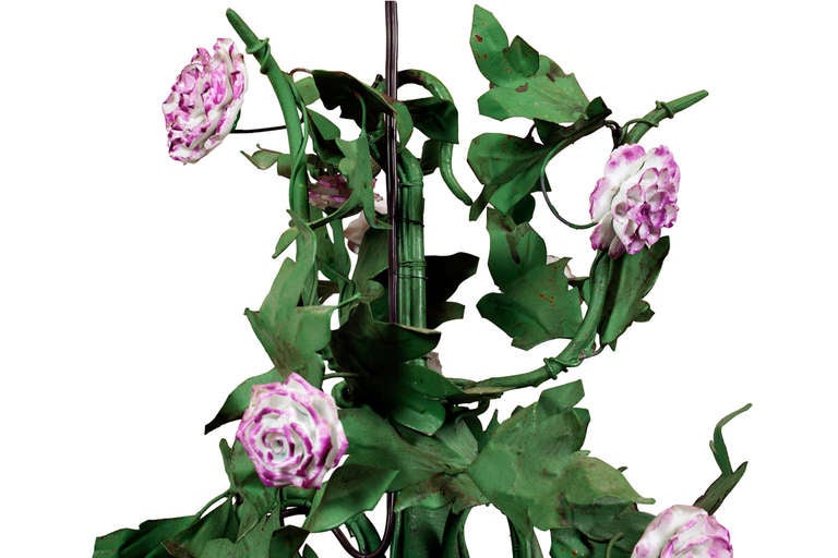 Late 19th century green tole chandelier with hand-painted pink porcelain flowers and six lights. Wired.