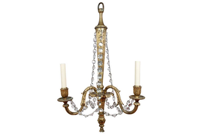 A late 19th century Louis XVI style gilt bronze and crystal three-arm chandelier.