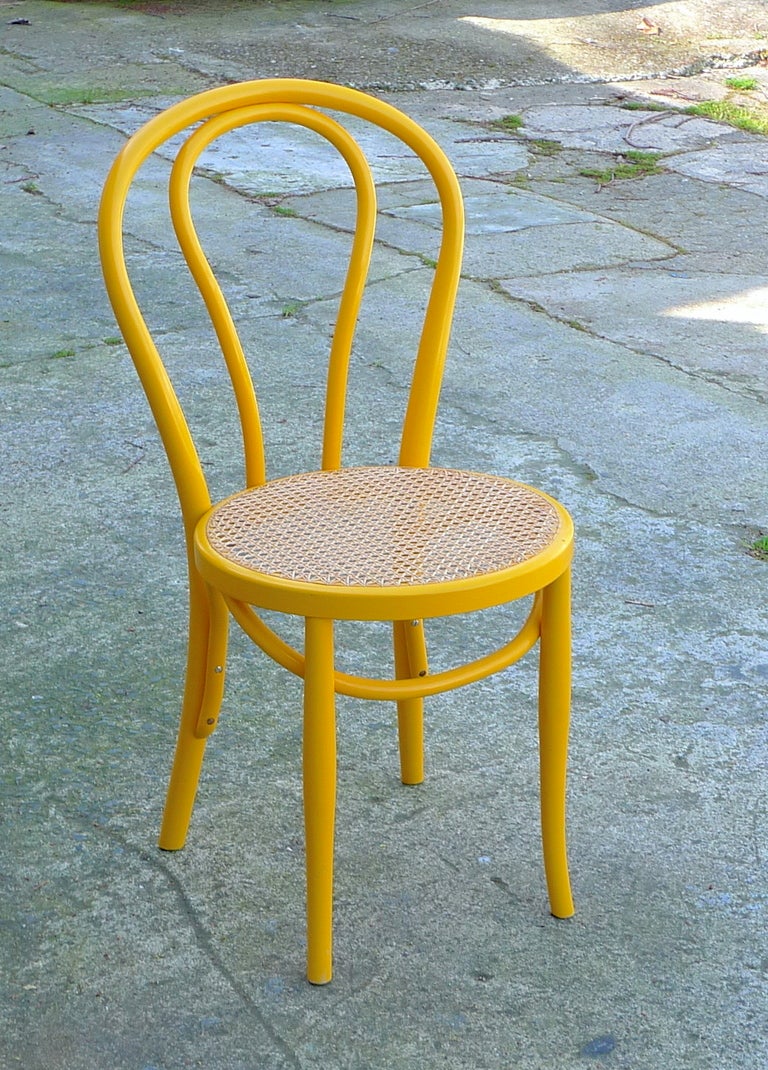Vibrant yellow bentwood riff on Germany's 1859 Classic Michael Thonet No. 14-now 214 Bistro chair.
Akita Mokko Co. Ltd is a bent wood furniture company founded in 1911.  They source ther wood from the broad-leaved trees growing in the Tohoku