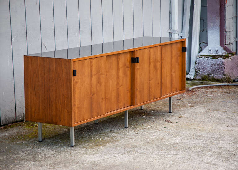 Vintage Knoll walnut credenza with black leather pulls 1952-1978
Walnut frame and doors with black laminate top, natural oak shelving inside for each quad.