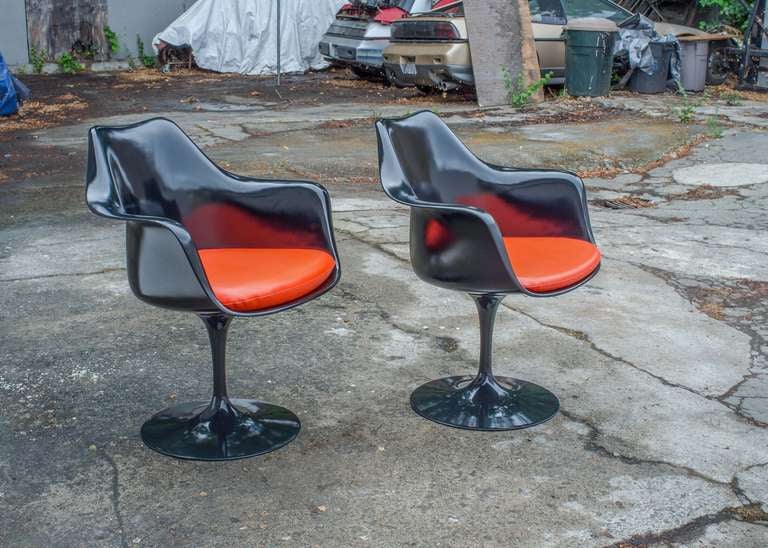 Eero Saarinen Tulip armchair design for Knoll, 1957.  This striking black version with red/orange 