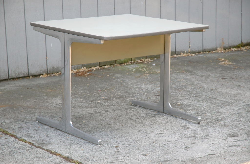 Square top table/desk/return with laminate top on metal base by George Nelson Action Office table for Herman Miller 1964<br />
Early example of Nelson's groundbreaking office design group.  Extruded aluminum base with cross members at top and