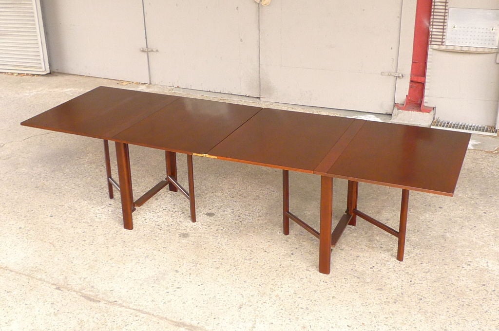 Fully collapsible walnut gateleg dining table.
Scandinavian, period, quality riff on iconic 