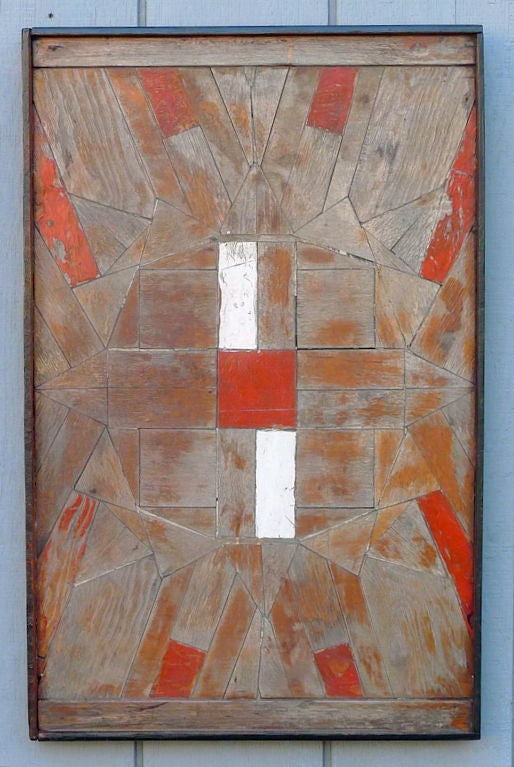 Tramp Art wood wall hanging with orange-red and white accents.<br />
Virtuoso assembly of individually shaped sheets of wood meticulously interlocked across plywood in a cloisonne-like composition. <br />
Unknown artist demonstrates here the