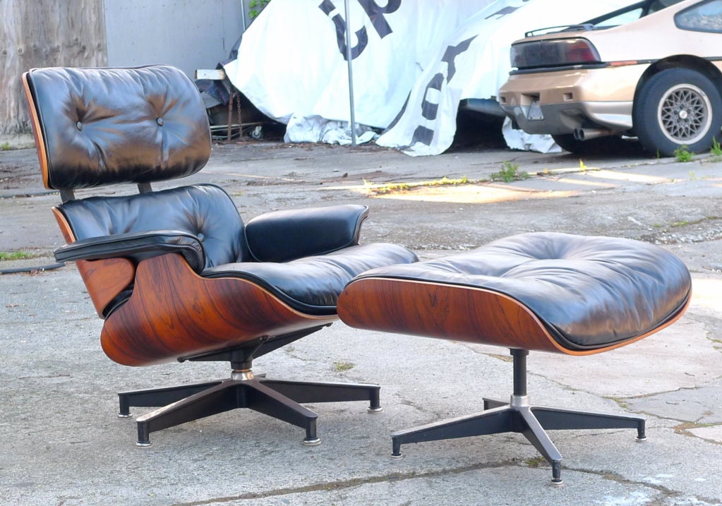 Classic 670/671 lounge chair & ottoman by Charles Eames for Herman Miller. 
Rosewood shell with leather covered foam/down cushions.
Detailed dimensions:
Chair 34”ht 34”dp 34”w 16”seat ht
Ottoman: 21.5”dp 26” 17”ht