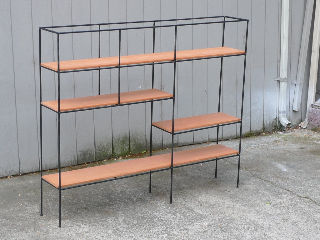 Room-divider/shelving-unit by Muriel Coleman of the 1952 Pacifica Group. 

Rare and inventive shelving/room-divider by Coleman designed in 1952 is an iconic example of California design.

Coleman, a member of the Pacifica Group based in