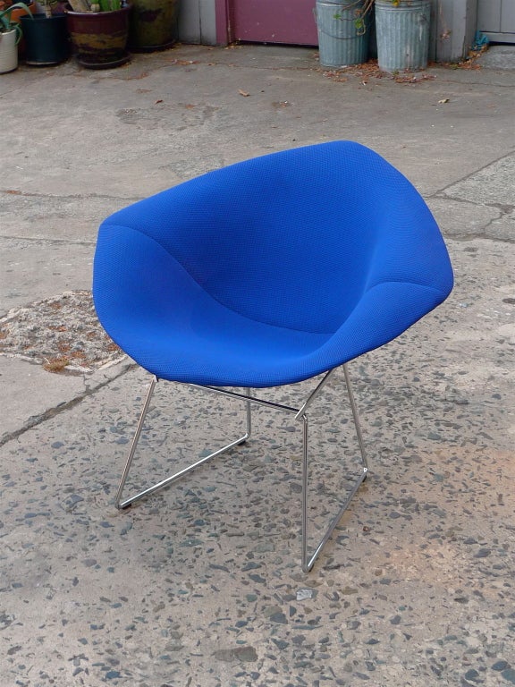 Current production example of 1952 Harry Bertoia design for Knoll.
Free form chair with vibrant blue/black cover on diamond shaped chrome wire frame.
Cato Blue wool wafer cover over thin layer of latex foam.
Hand built diamond shaped chrome wire