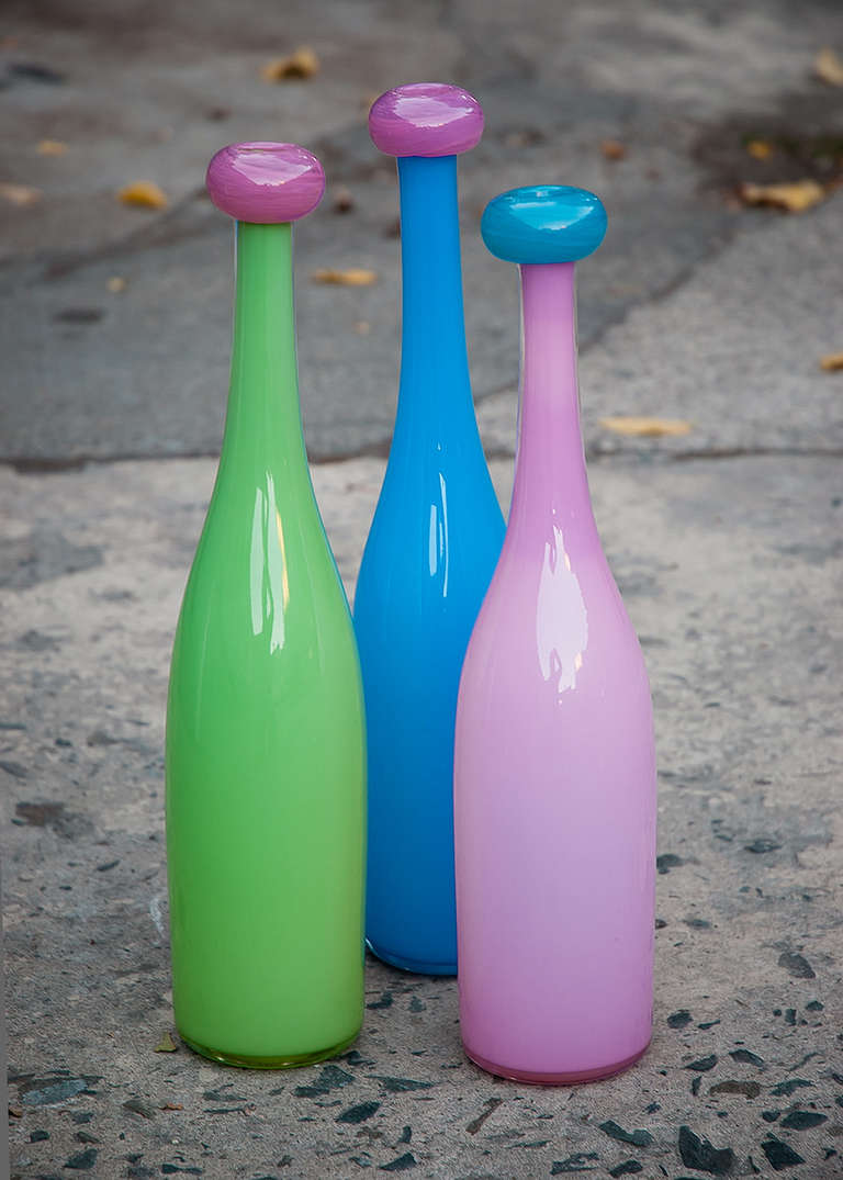 Chuck Vannatta studio glass trio of pink/blue, blue/pink and green/pink bottle shaped vases.
All three vases artist signed and dated with etching to bottom: 
