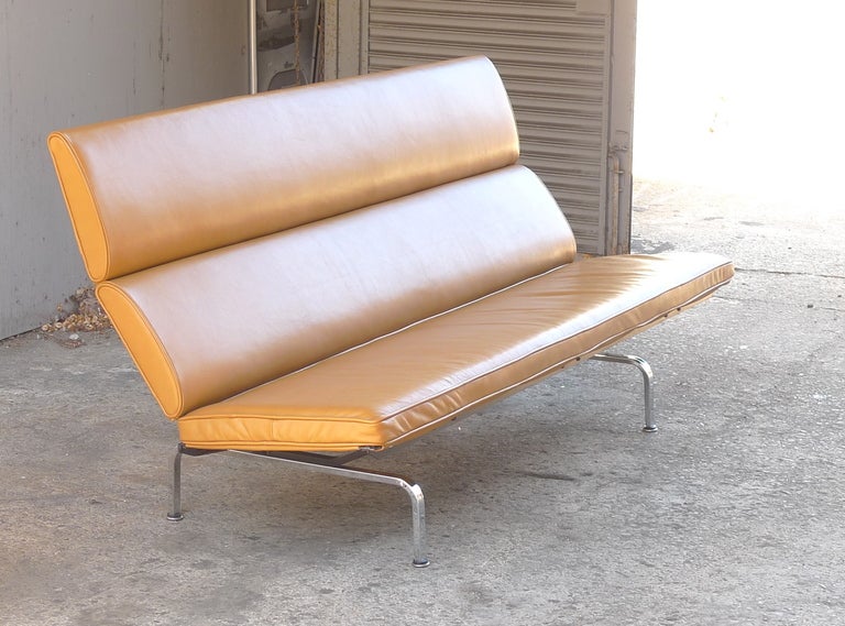 Charles Eames “Sofa Compact,” for Herman Miller designed in 1954. 
This period example re-upholstered in top-grain leather hide with high density latex foam. Leather unavailable new.
Unique folding sofa for ease of transport. 
Unusual high back