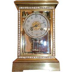 Reloj de ménsula de bronce americano antiguo