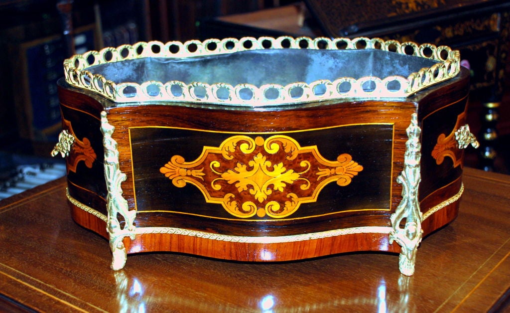 Antique French mahogany with satinwood, kingwood inlay and bronze mounts with original tin liner.