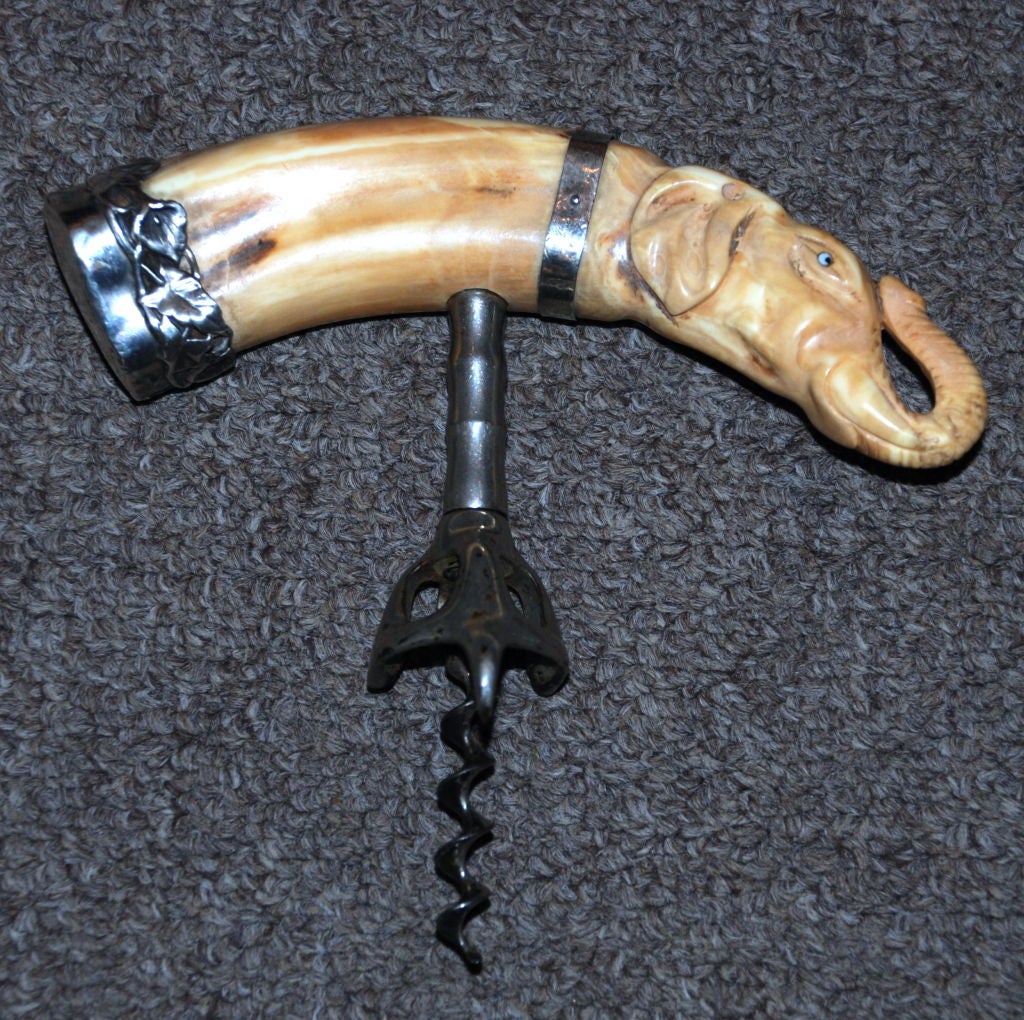 Antique American Carved Boars Tusk in the form of an Elephant with Sterling Silver Mounts