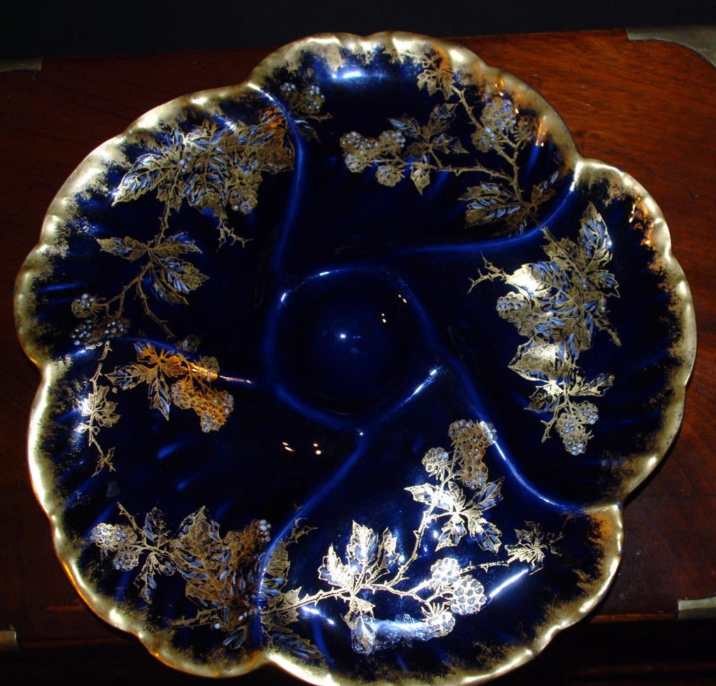 Hand Painted jeweling C.F. Haviland Limoges Oyster Plate. The coloring is Cobalt Blue with Gold trimming.