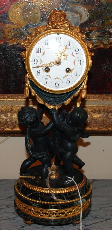 Antique French Drimulu Clock with Cupid figures.