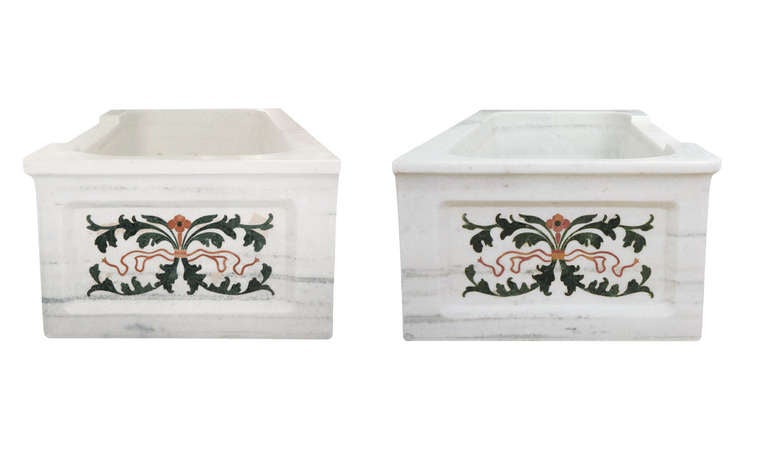 Verde and rosso marble inlay.

The lines visible on the inside and outside of the tub are marble veining and colorations.
