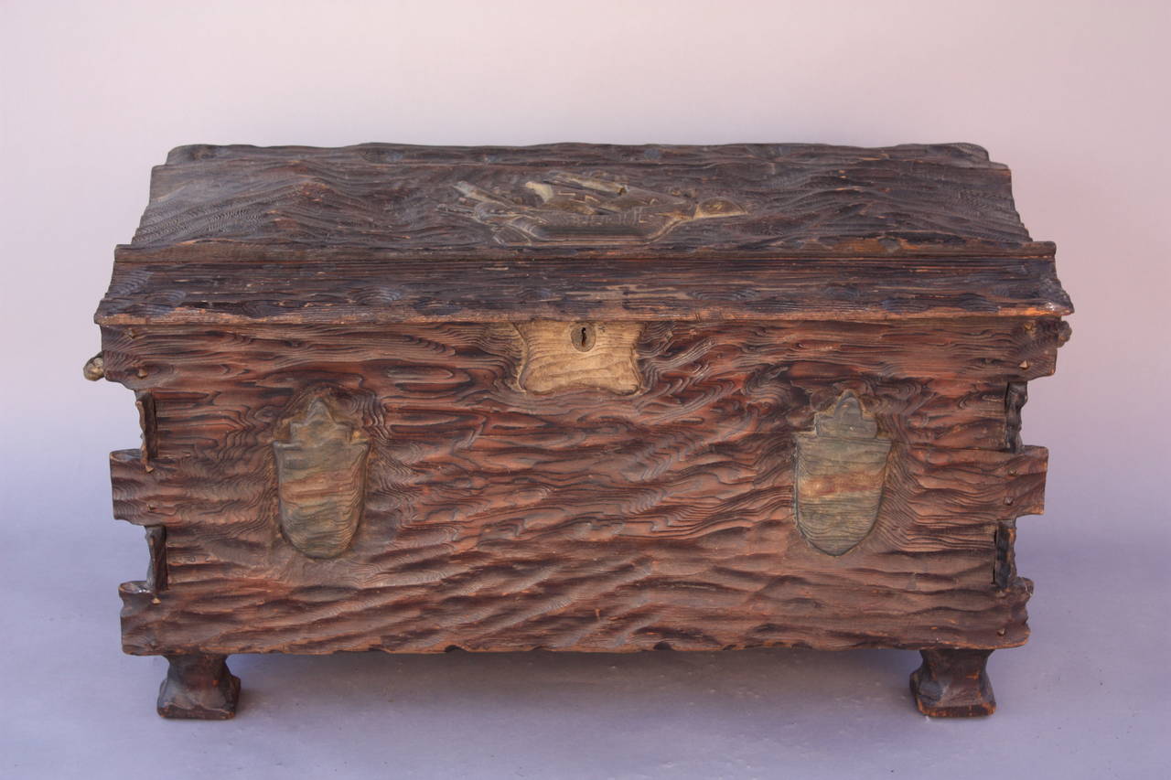 Circa 1930's trunk with over the top carving. Cedar lined. 22.75