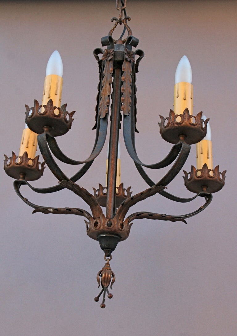 Spanish Revival chandelier with 5 candles. Original polychrome finish. Acanthus leaf pattern. Circa 1920's. 18
