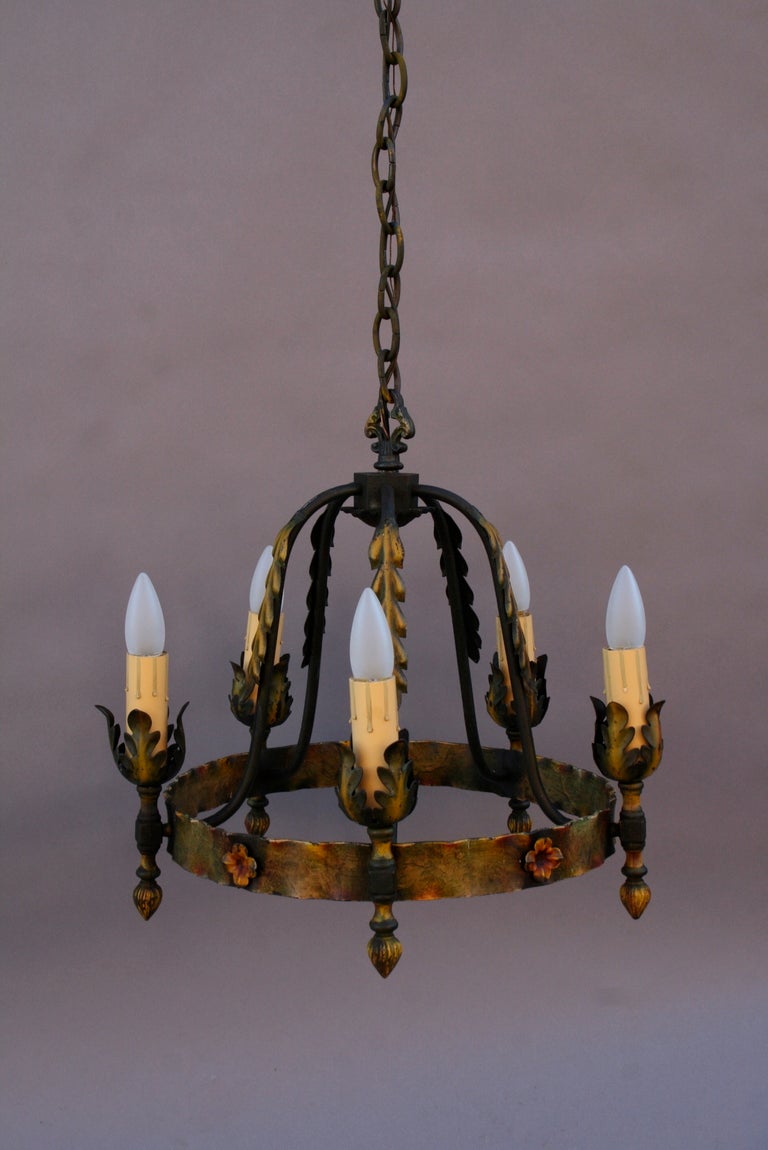 Circa 1920's chandelier with acanthus leaf motif and all original polychrome finish. American. Salvaged in the Los Angeles area from a Mediterranean home. Fixture itself measures 19