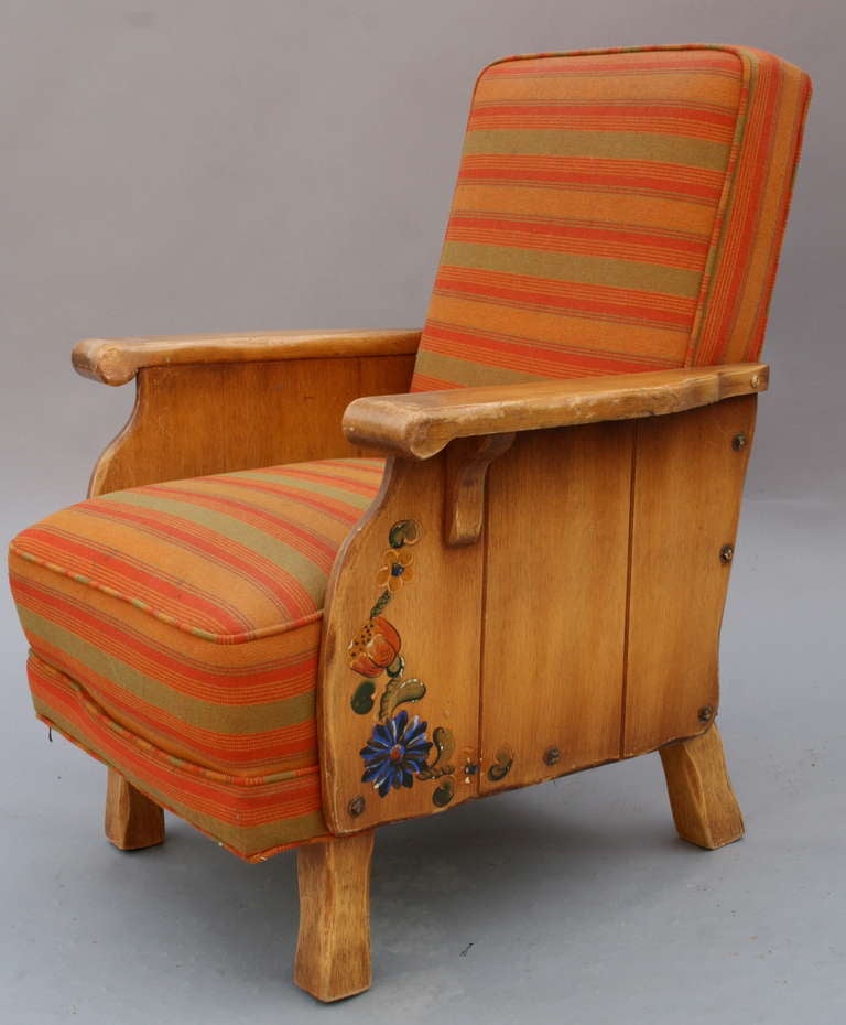 Circa 1930's armchair with vibrant upholstery. Hand painted decoration.