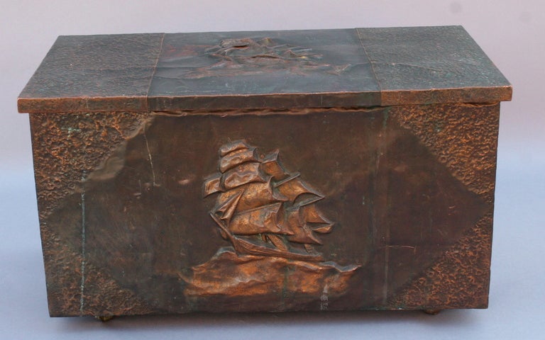 Wonderful wooden chest clad in sculpted sheets of copper, with Spanish galleon motif on top and face.