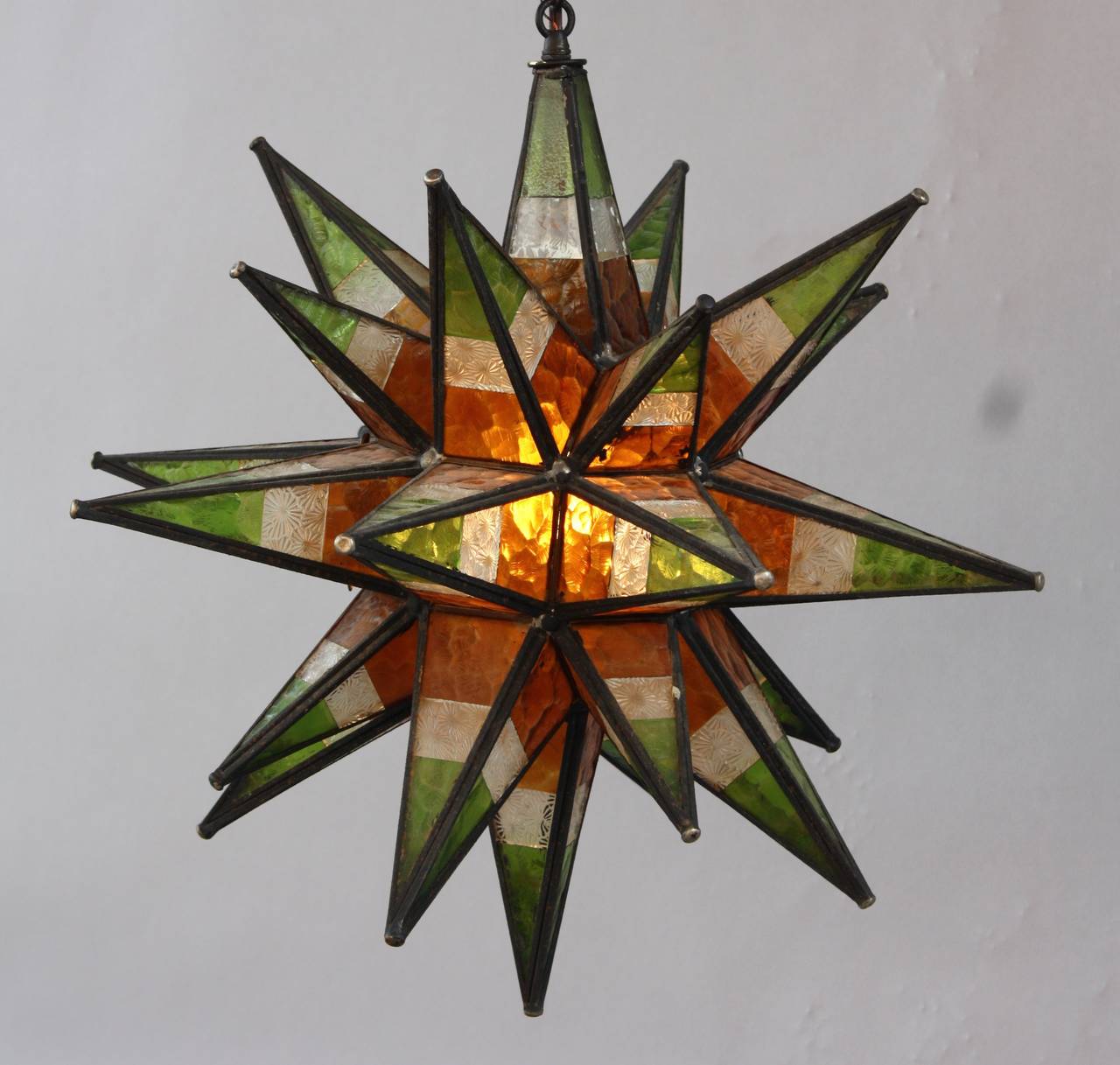 Hard to find Moravian star with multicolor stained glass. Circa 1930's.. Body of fixture is 21