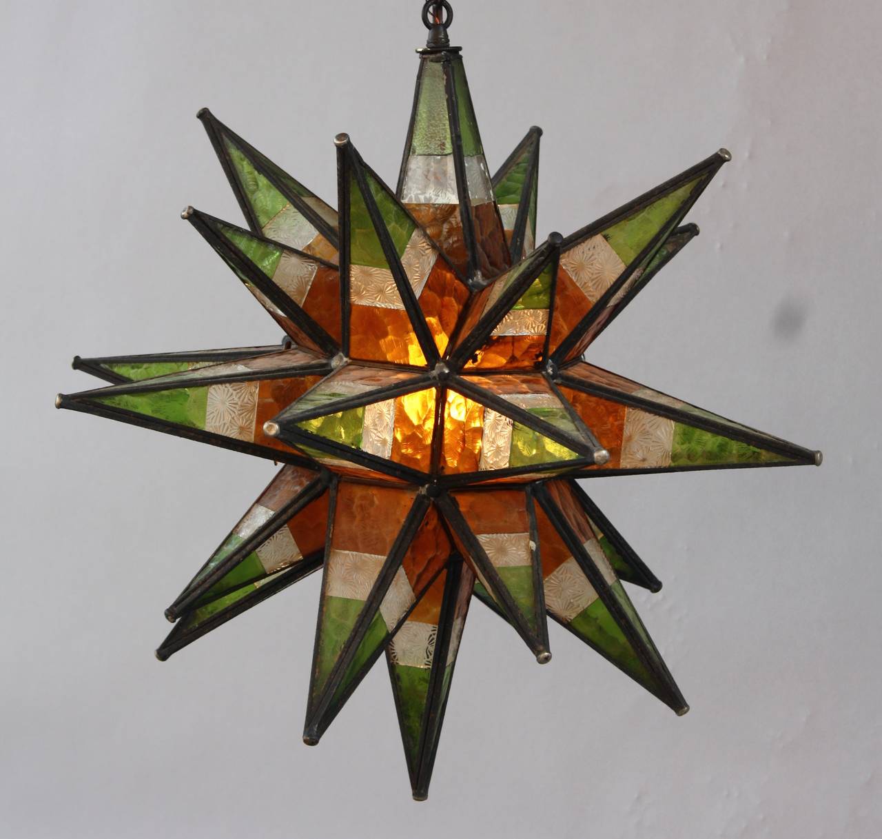 Hard to find Moravian star with multicolor stained glass. Circa 1930's.. Body of fixture is 21