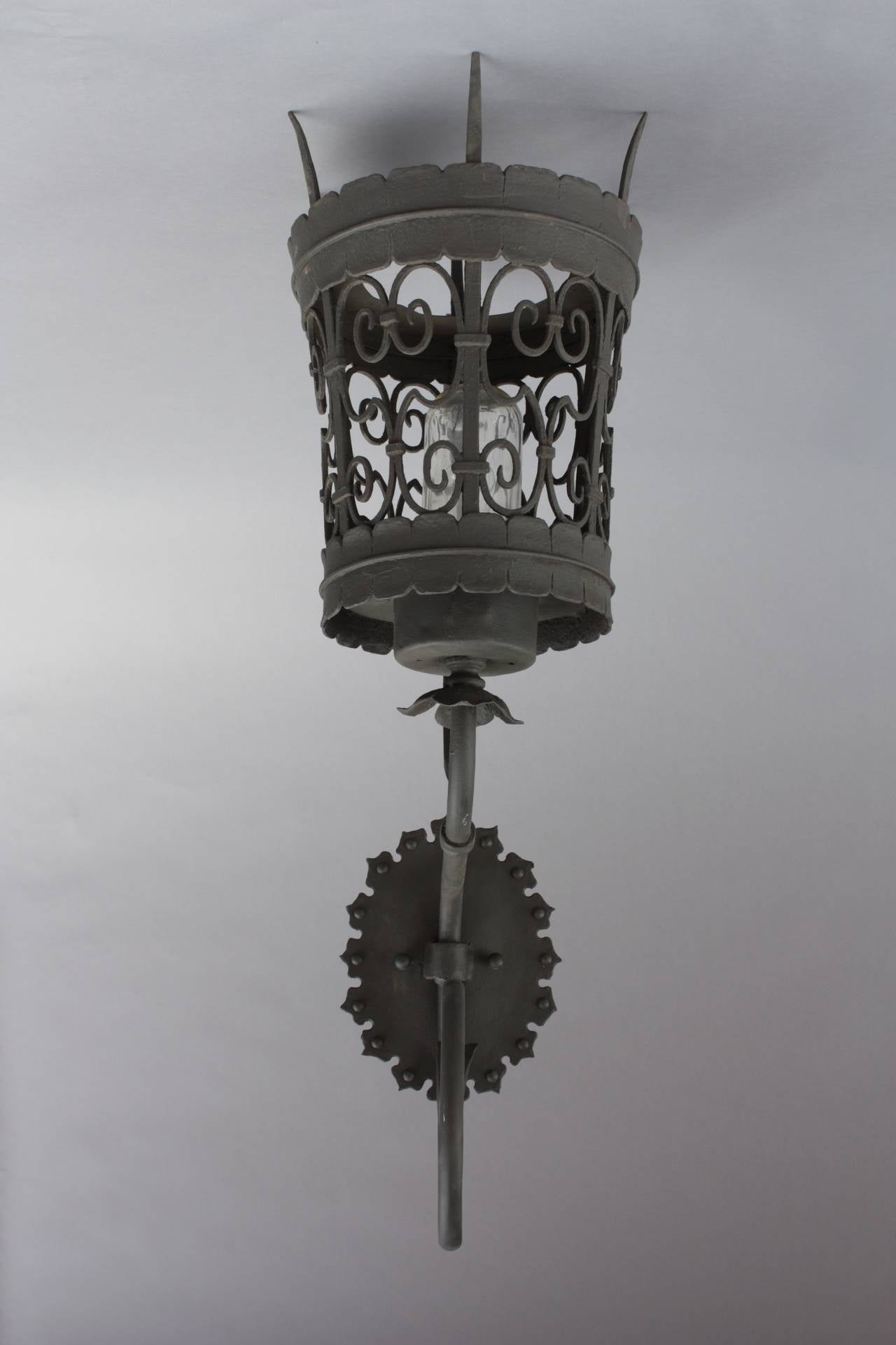 Circa 1920's wrought iron exterior wall mounted lantern. 37.25