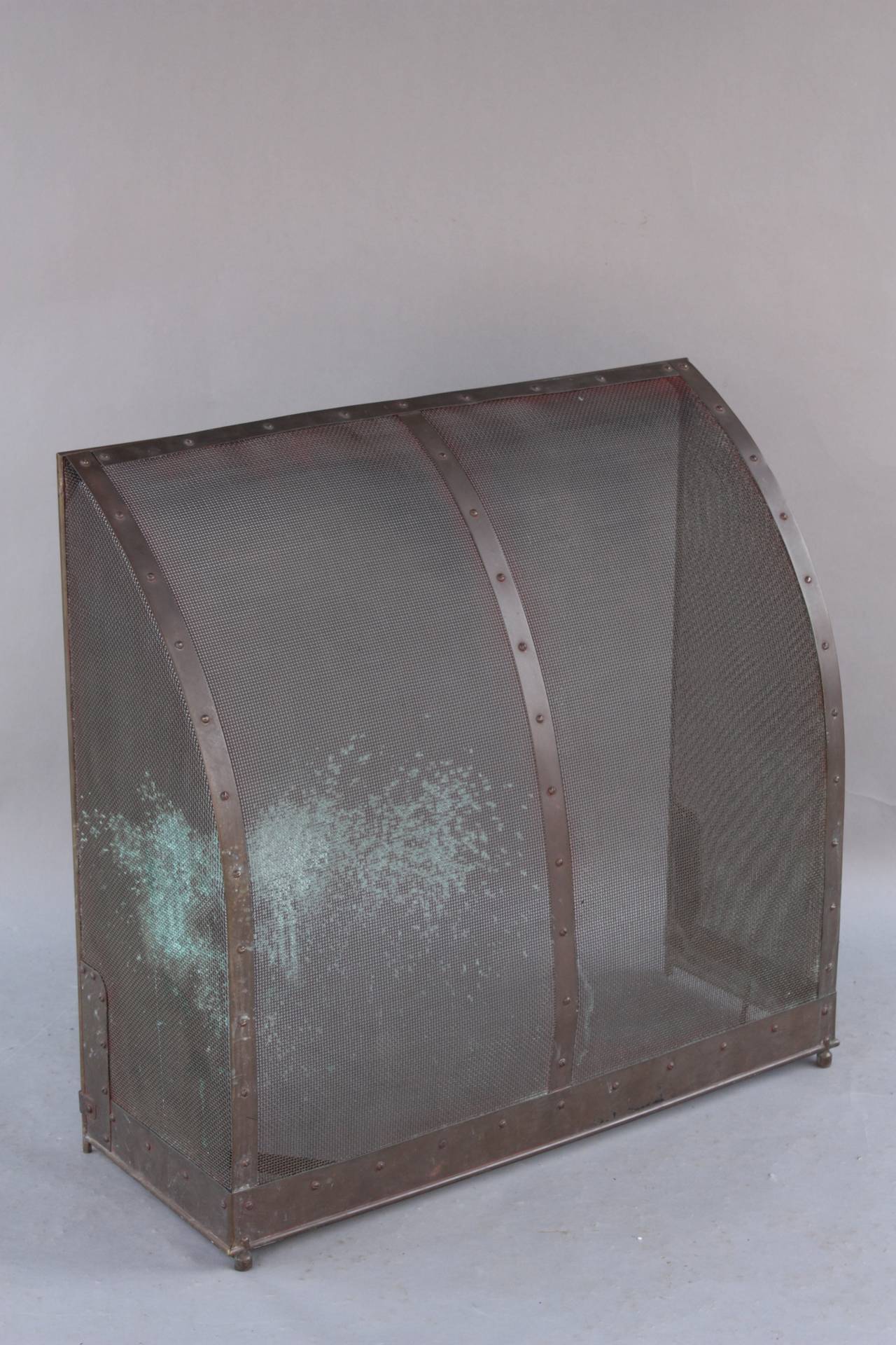Freestanding fire screen with curved front. It measures 31