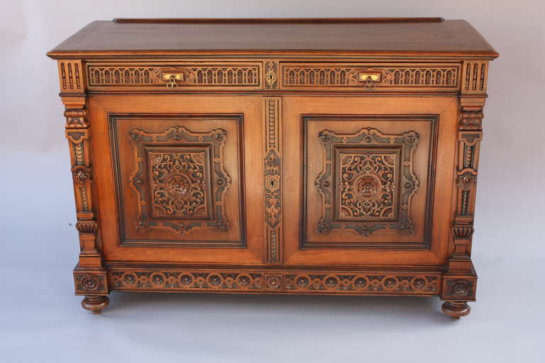 1920's mahogany and walnut sideboard. Very finely carved. Rich original finish. 

58