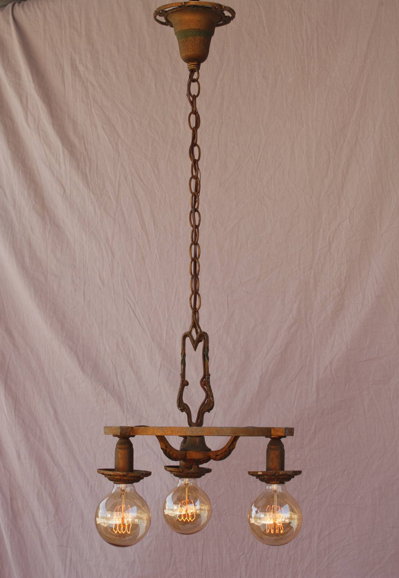 Circa 1920's chandelier with polychrome finish. Body of fixture is 14.5
