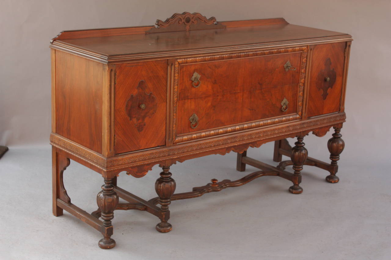 Circa 1920's sideboard with two drawers and two side doors. Beautiful wood grain. 75