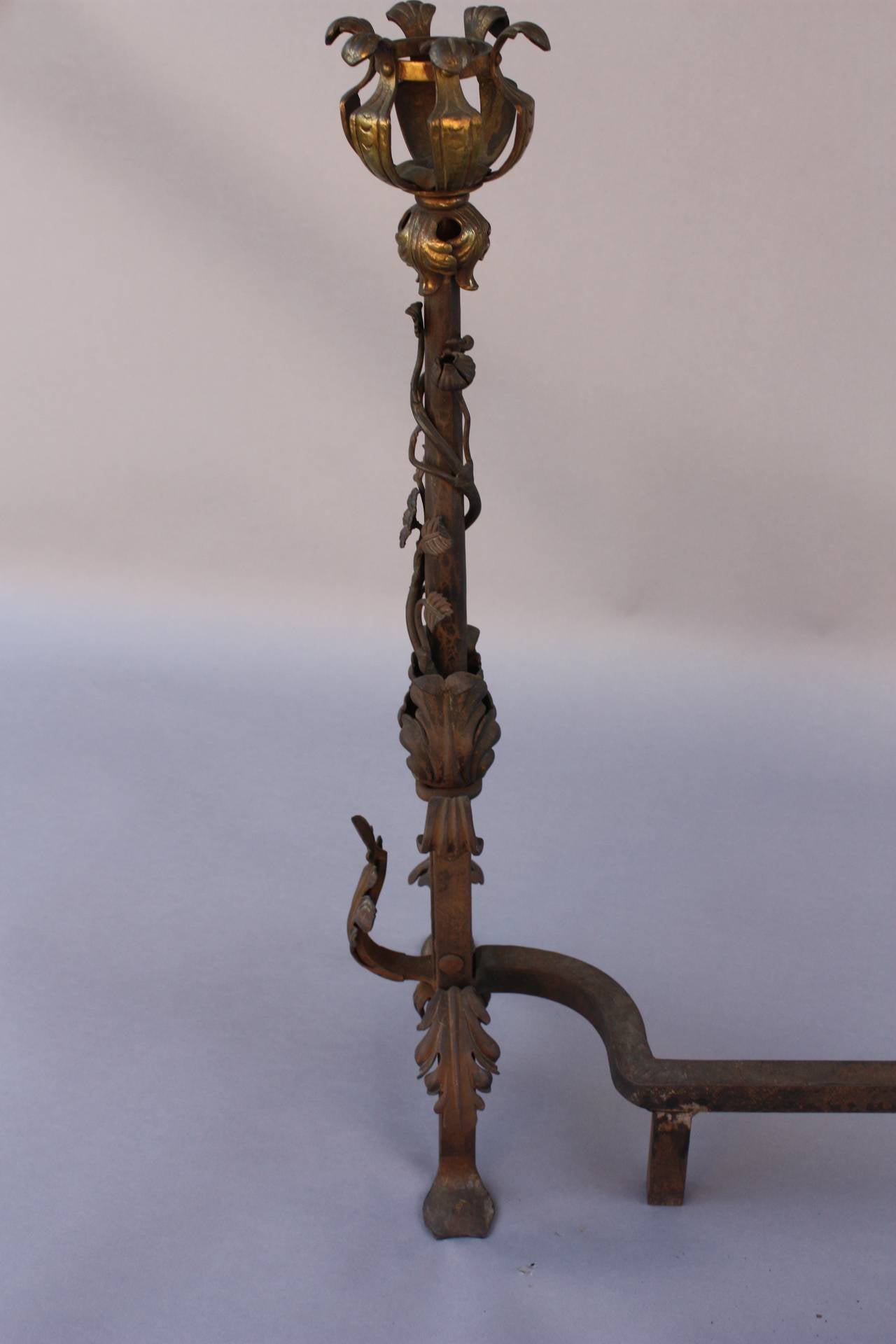 Circa 1920's pair of andirons with fabulous iron and bronze work. 
Measures:26.1/4