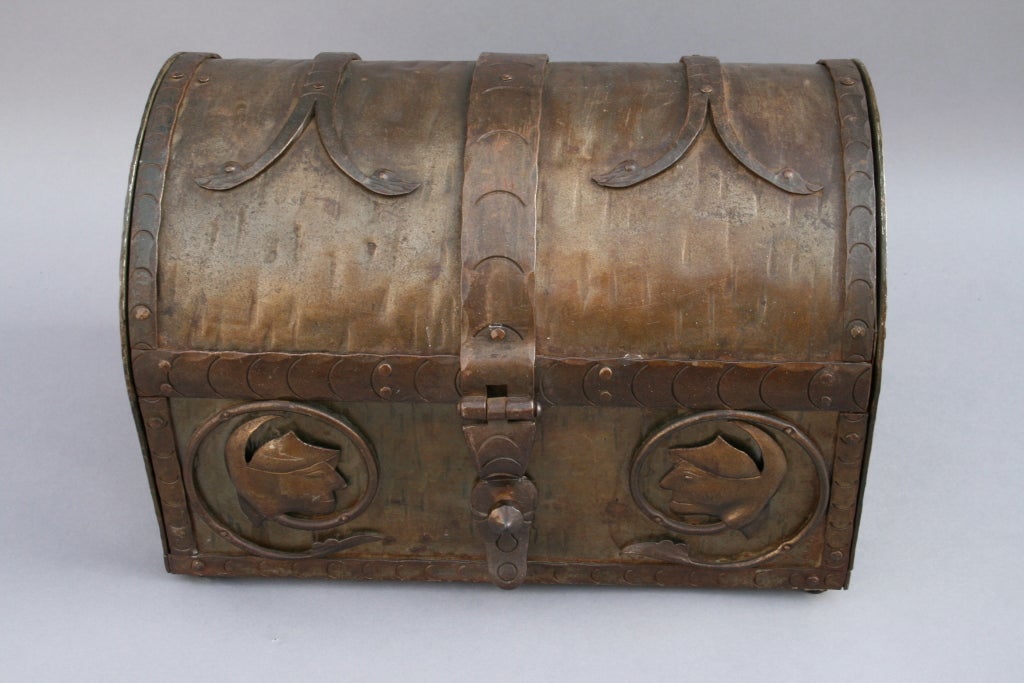 Crafted with heavy iron work this chest has many finely crafted elements including subtle iron repousee faces.