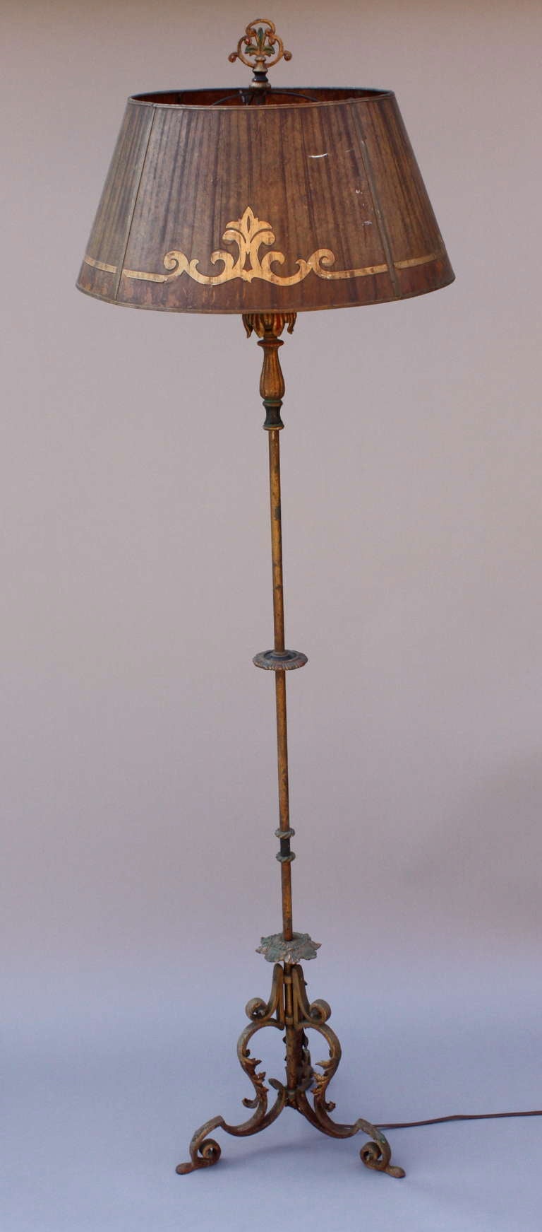 Classic 1920's floor lamp perfect for the Spanish Revival or Mediterranean style home.  Nice original finish with polychrome accents and original mica shade.