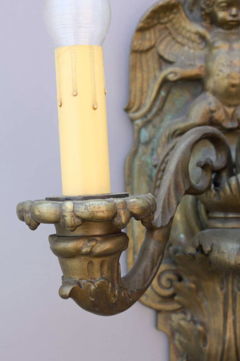 20th Century Pair of Bronze Sconces with Winged Cherubs and Acanthus Motif For Sale