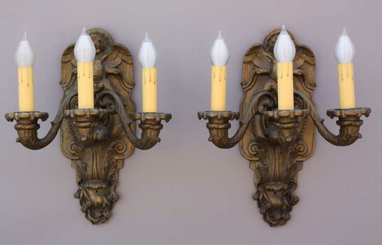 Pair of Bronze Sconces with Winged Cherubs and Acanthus Motif In Excellent Condition For Sale In Pasadena, CA