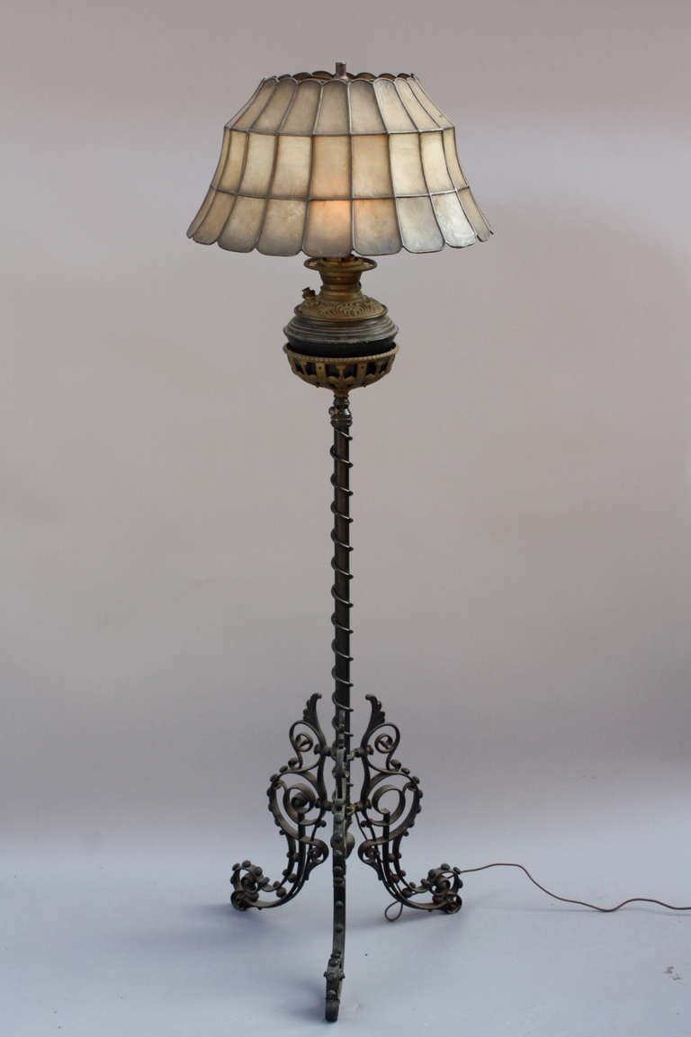 Wrought Iron Lamp With Capiz Lampshade
Turn of the century standing lamp which originally was a oil lamp and then got converted in 1920's with capiz lampshade. 