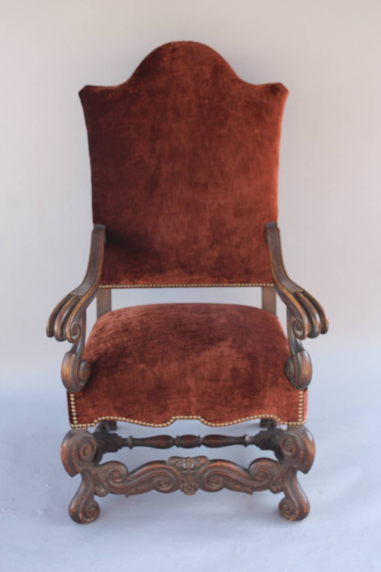 Circa 1920's armchair with carved walnut frame and new velvet upholstery 28.5: W x 26