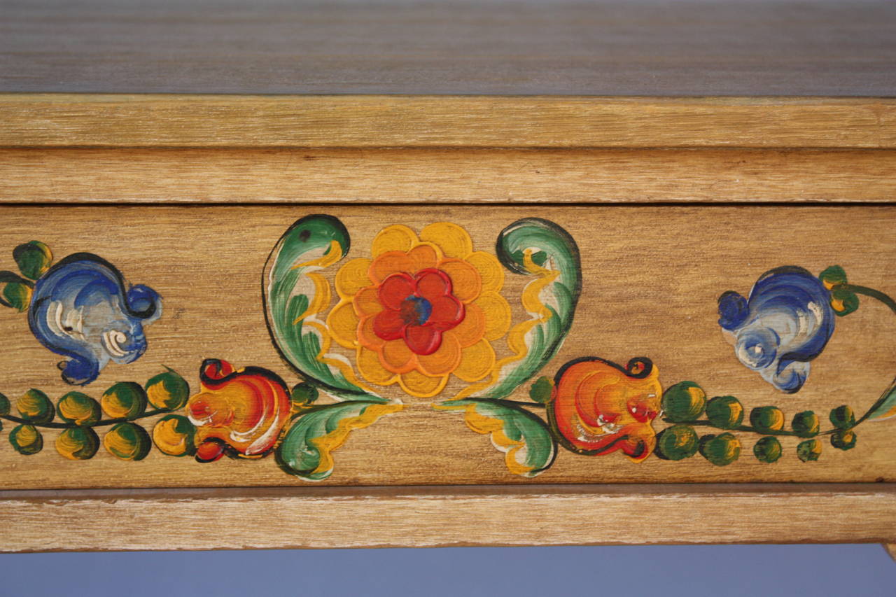 Circa 1930's side table with vibrant painting on front drawer. Made by the Coronado Company. 37