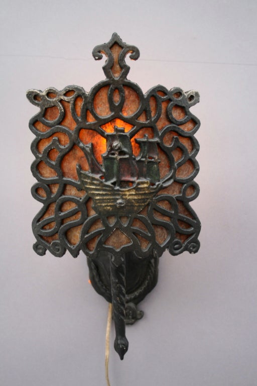 Priced individually.  c. 1920's wall sconce with original polychrome paint.