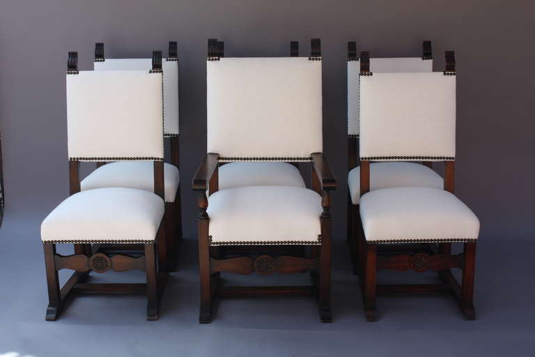 Circa 1920s. Newly Upholstered in linen. Carved walnut. Armchair measures 48