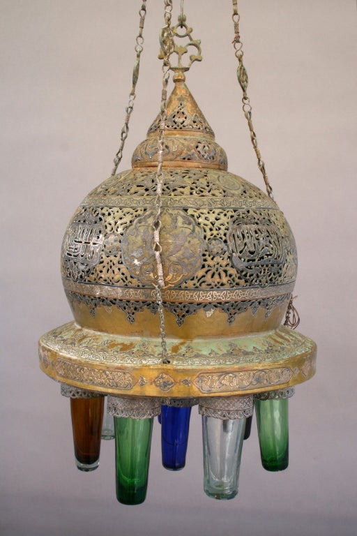Exceptionally rare Mamluk Revival lanterns from the 1926 Isham Natatorium designed by George Washington Smith; exquisitely crafted of bronze, brass, copper, and silver and retaining their original hand-blown glass pendants, these are rare and