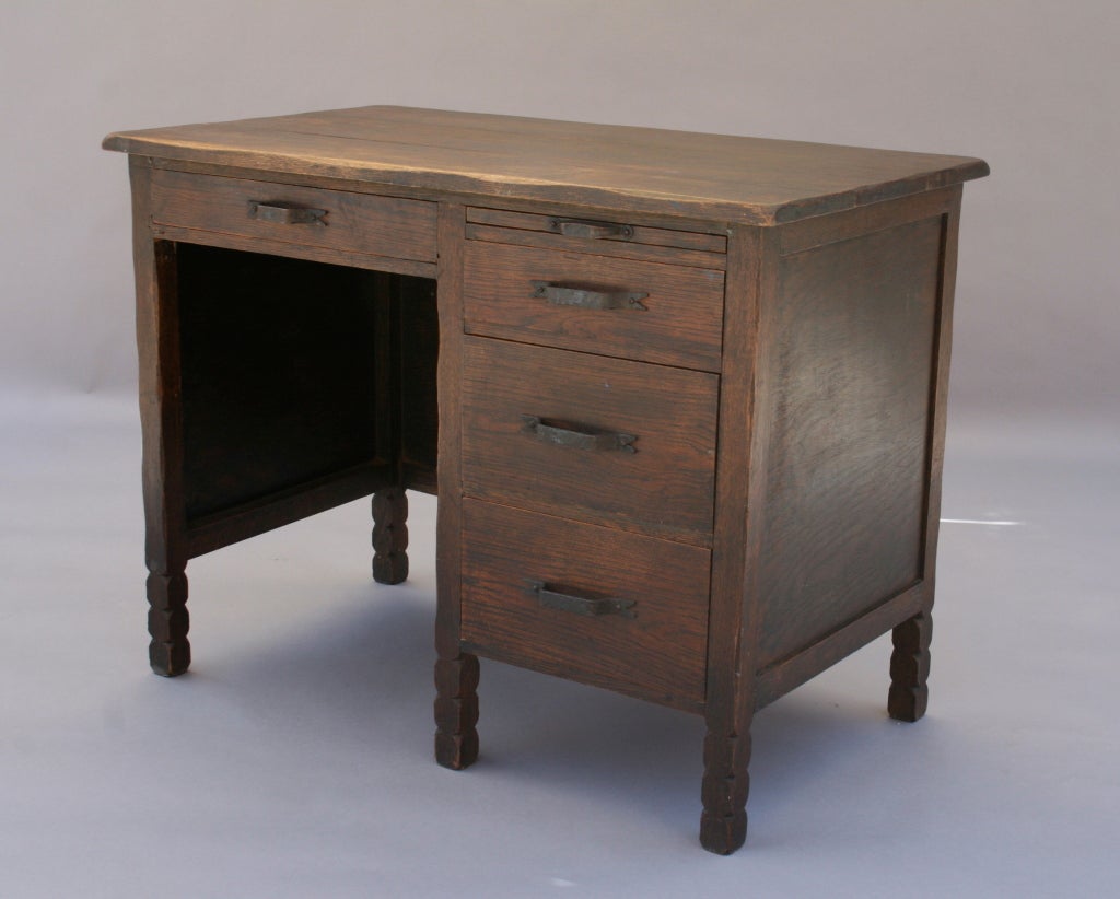 Rustic four-drawer desk with pull-out writing surface, great iron hardware, original dark finish, and large area for desk chair making it as functional as it is good-looking