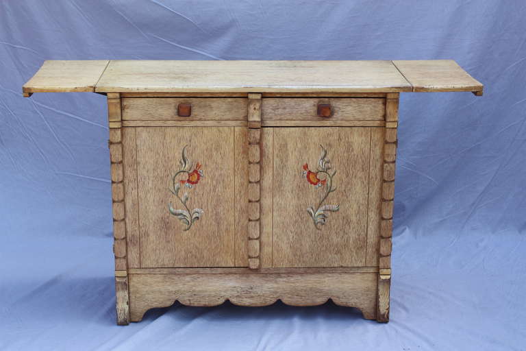 Circa 1930's sideboard with original finish and hand painted decoration. 35