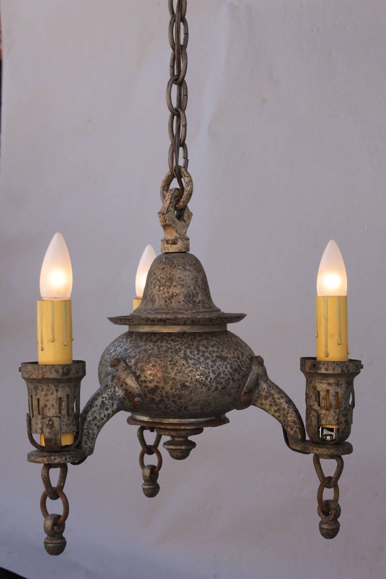 Compact 1920's chandelier with hammered texture. Measures: 16