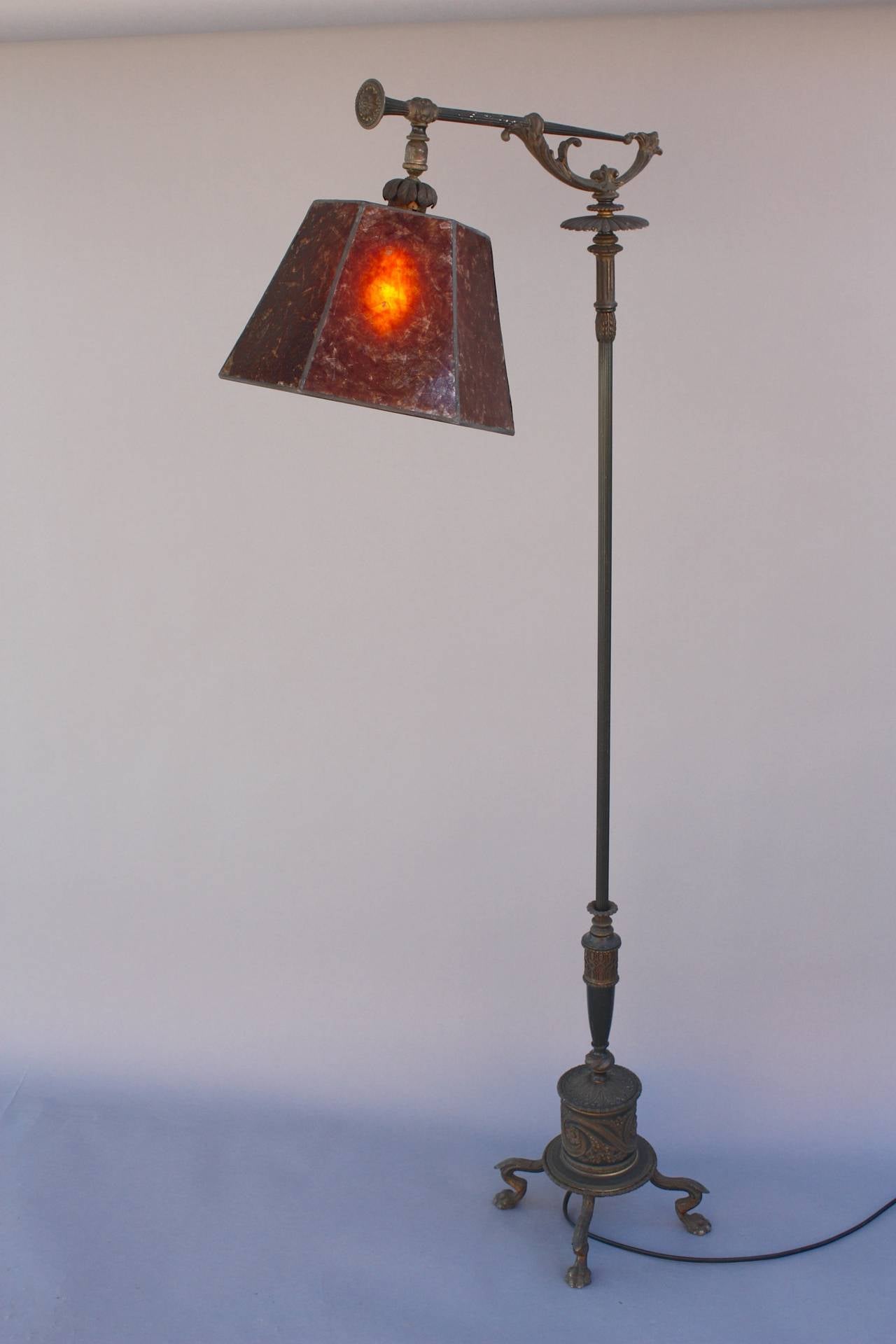 Circa 1920's lamp with new mica shade. Beautiful casting-work on base. 59