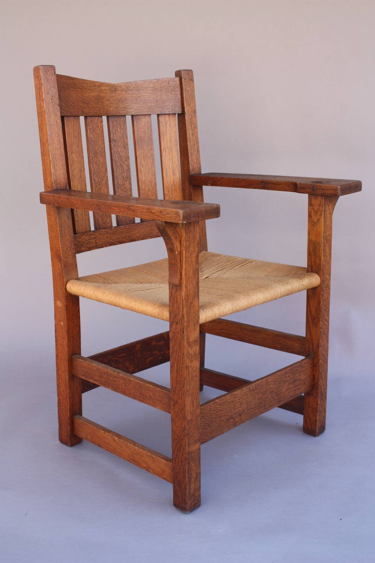 Priced for the pair. One chair retains boxed early mark (1902-1903) Quarter sawn oak. The chair show a little wear normal for age of these pieces. Measures: 37.5/8