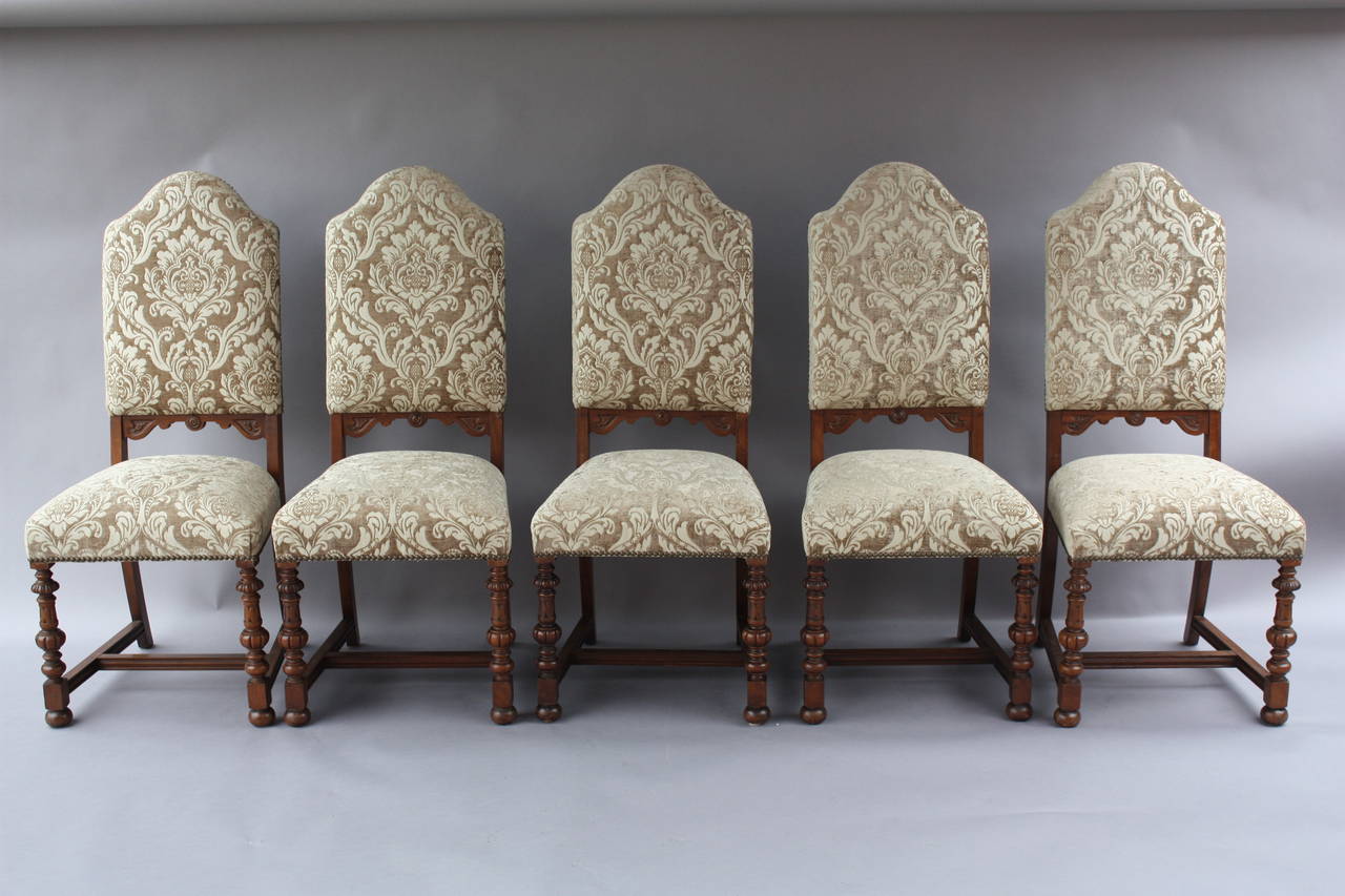 Circa 1920's carved walnut chairs with one armchair and 5 side chairs. Armchair is 24.5