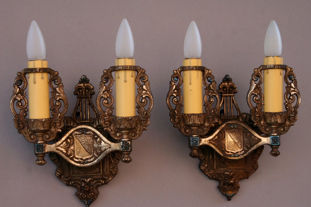 Priced for the pair.  Detailed casted sconces with original finish
